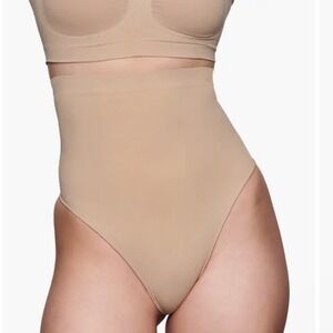 SKIMS | Seamless Sculpt Stretch Shapewear High Waisted Thong Undies, Clay, S